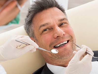 Man smiling at dental office